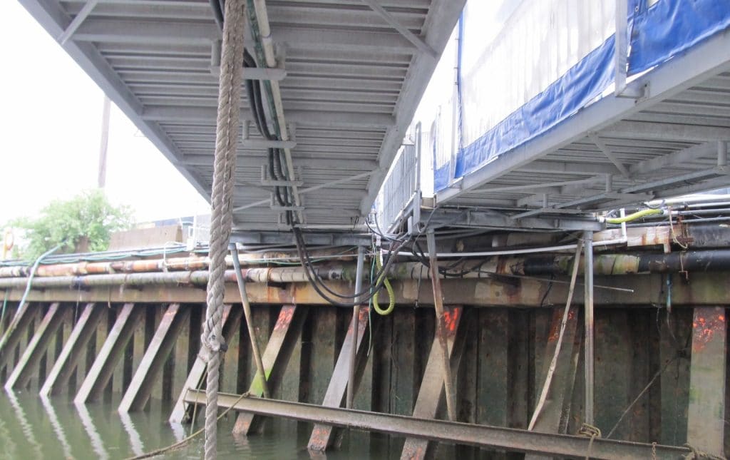 Case Study on the Collapse Potential of a Wharf Supported by Severely Deteriorated Steel Piles under Gravitational Loads
