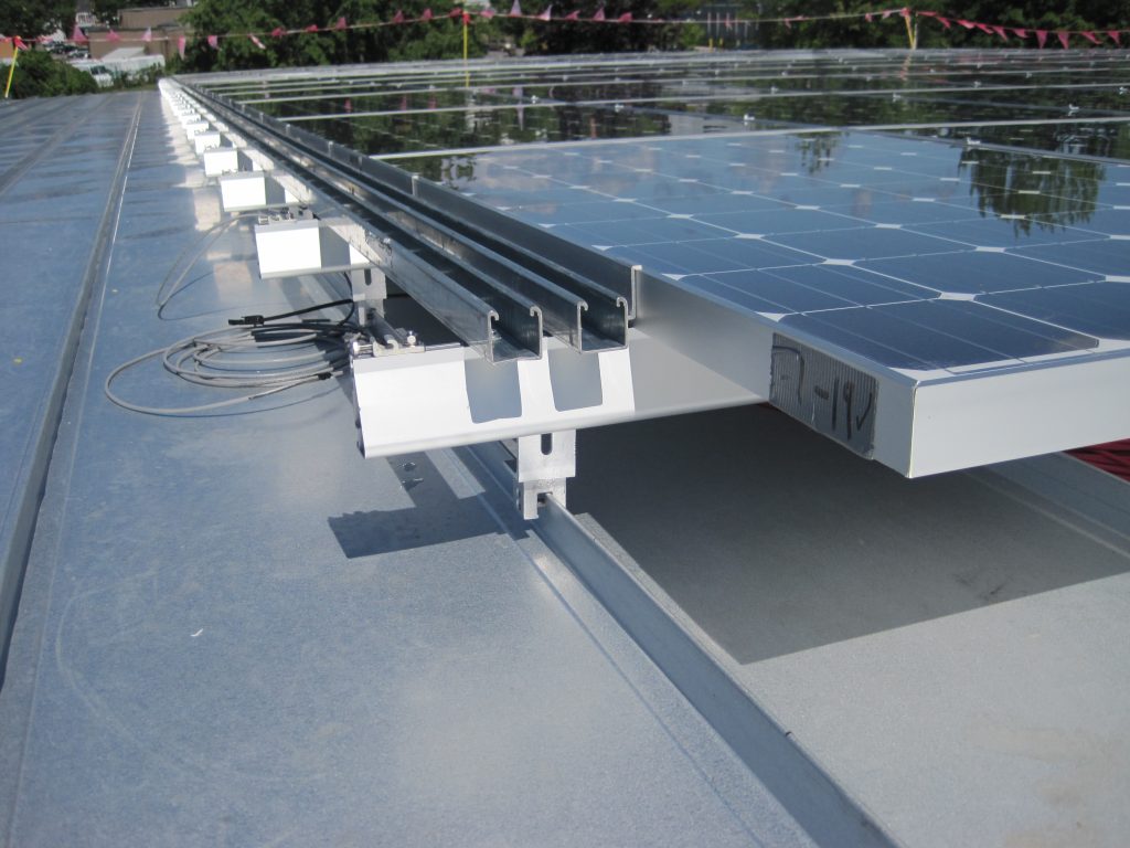 Understanding How Photovoltaic Systems Affect Low-Slope Roofing Projects