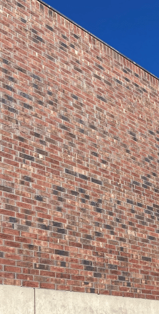 Cracked, Spalled, and Displaced Brick Facades: Restore or Replace?