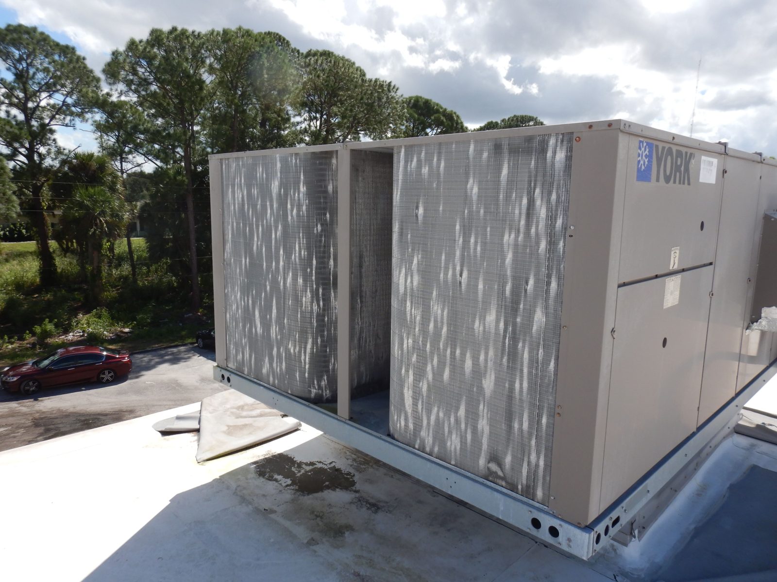 Hail damage on rooftop HVAC equipment.