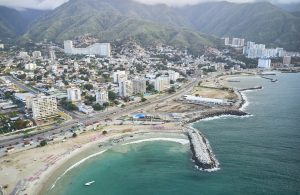 Aerial view picturesque public beach with turquoise water. Highway in Los Corales, La Guaira, Venezuela